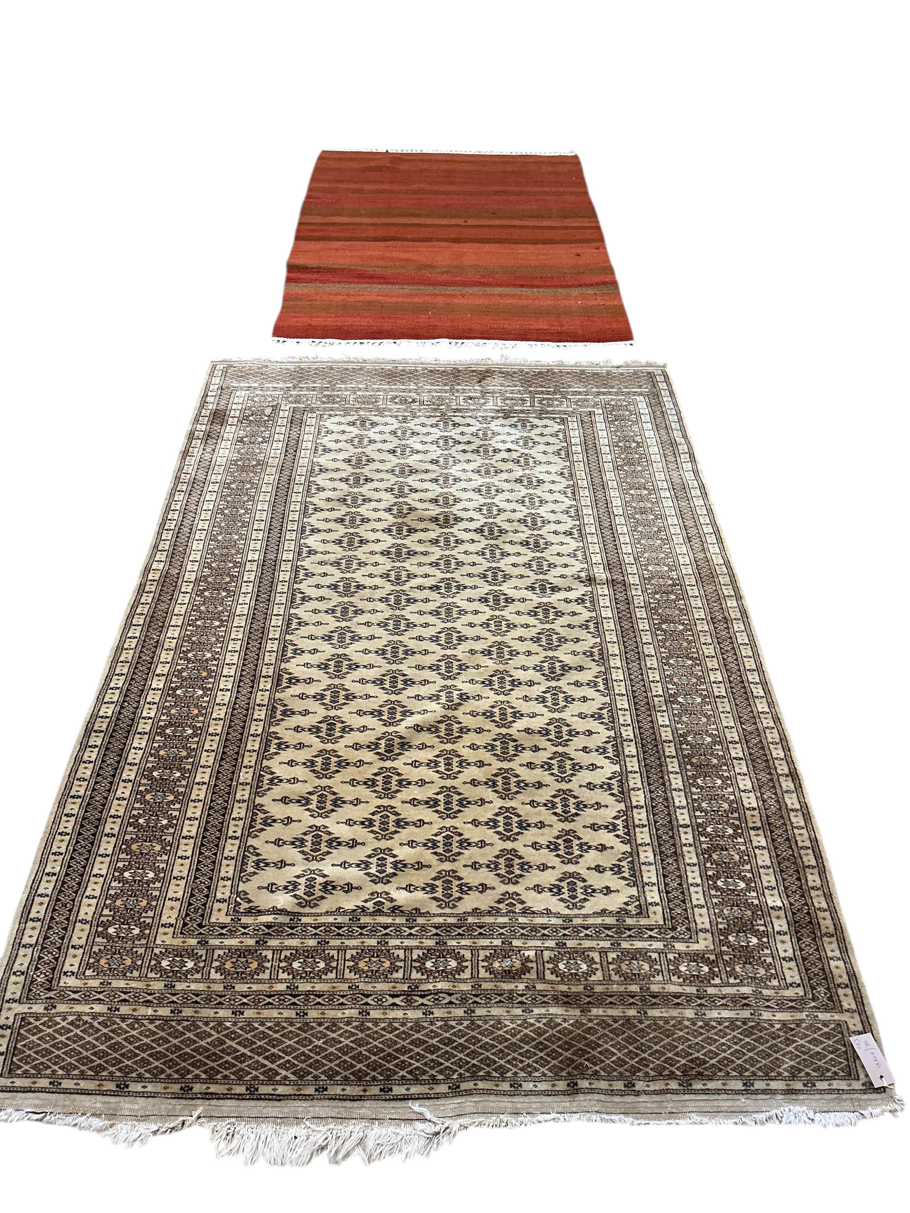 A North West Persian fawn ground rug, 196 x 126cm together with a flatweave rug